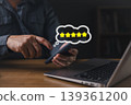Customer quality review and satisfaction concept,hand hold smartphone with five star in bubble.Excellent service rating, user feedback,product standard,good experience survey,digital communication. 139361200