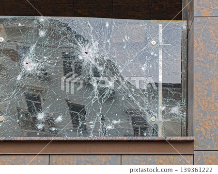 Damaged armored glass fence Damaged armored glass fence 139361222