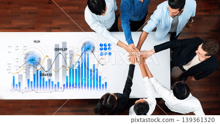 Team Collaboration with Business Graphs and Data Charts on Table Representing Growth and Strategy in Modern Office Environment Scalp 139361320