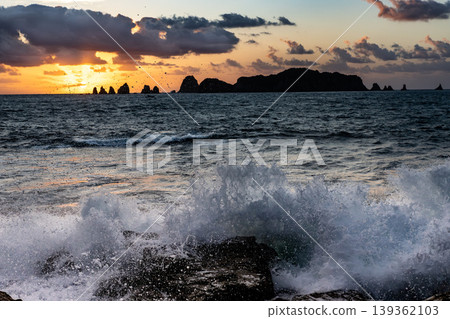 Sunrise and crashing waves off the coast of Nanatsu-iwa in the Hyuga Sea, Nichinan City, Miyazaki Prefecture. Sunrise and crashing waves off the coast of Nanatsu-iwa in the Hyuga Sea, Nichinan City, Miyazaki Prefecture. 139362103