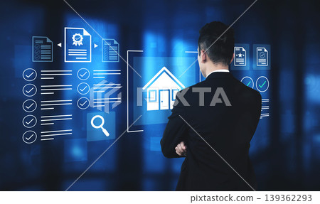 Business professional analyzing digital interface for real estate management with data visualization, charts, and house icon in futuristic workspace Gantry 139362293