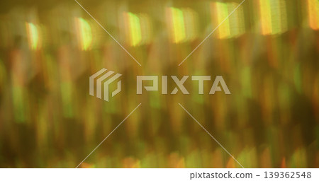 Striped blur glow. Leak prism. Kaleidoscopic pattern light wavy reflection. Yellow green color crystal lens texture abstract background. 139362548