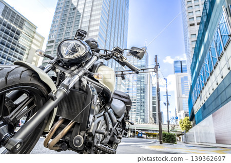 An American motorcycle parked in the high-rise building district in front of Tokyo Station. An American motorcycle parked in the high-rise building district in front of Tokyo Station. 139362697