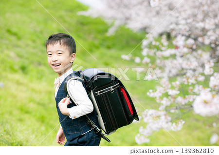 Elementary school boy carrying a school bag Elementary school boy carrying a school bag 139362810