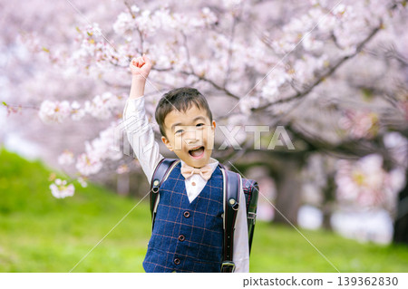 A boy carrying a school bag 139362830