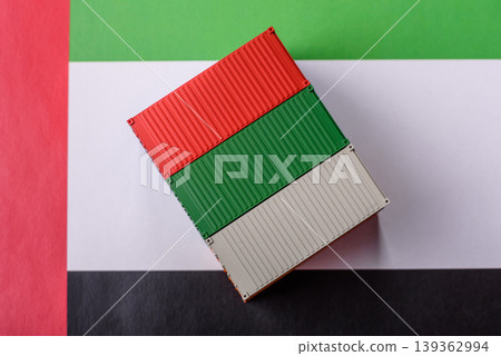 Cargo containers on the UAE flag as a conceptual backdrop for goods export. Cargo containers Cargo containers on the UAE flag as a conceptual backdrop for goods export. Cargo containers 139362994