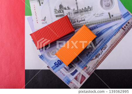 Cargo containers on the UAE flag as a conceptual backdrop for goods export. Cargo containers 139362995