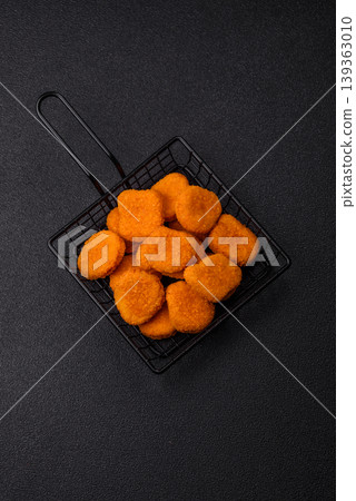 Fried chicken nuggets with sauce, salt, and spices, fast food, unhealthy food. Chicken nuggets 139363010