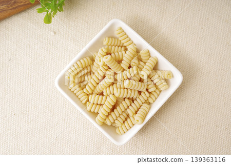 Product photography of short pasta served in a small dish. Product photography of short pasta served in a small dish. 139363116