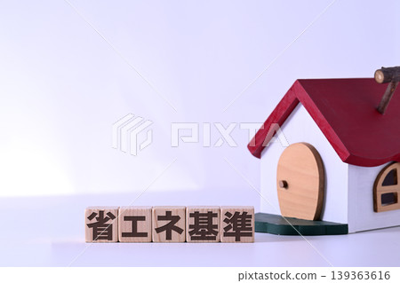 Energy-saving standards text and a house with a red roof Energy-saving standards text and a house with a red roof 139363616