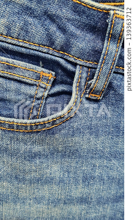 Close-up of blue denim jeans texture background Close-up of blue denim jeans texture background 139363712