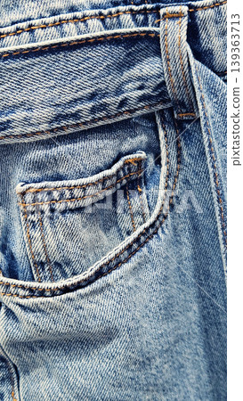 Close-up of a pocket on blue denim jeans overall Close-up of a pocket on blue denim jeans overall 139363713