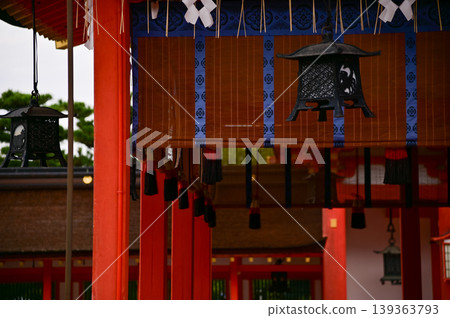 Close-up view of Fushimi Inari Taisha(Fushimi Inari Shrine) is a popular tourist destination in Kyoto, Japan. Fushimi Inari Shrine architecture. Building exterior. Close-up view of Fushimi Inari Taisha(Fushimi Inari Shrine) is a popular tourist destination in Kyoto, Japan. Fushimi Inari Shrine architecture. Building exterior. 139363793