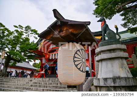 Close-up view of Fushimi Inari Taisha(Fushimi Inari Shrine) is a popular tourist destination in Kyoto, Japan. Fushimi Inari Shrine architecture. Building exterior. Close-up view of Fushimi Inari Taisha(Fushimi Inari Shrine) is a popular tourist destination in Kyoto, Japan. Fushimi Inari Shrine architecture. Building exterior. 139363794