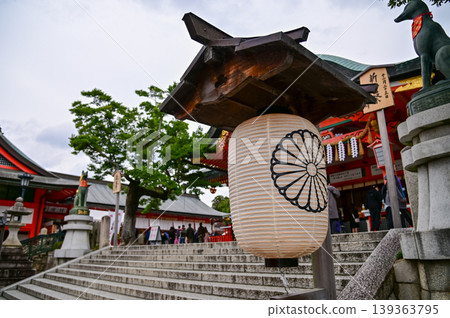 Close-up view of Fushimi Inari Taisha(Fushimi Inari Shrine) is a popular tourist destination in Kyoto, Japan. Fushimi Inari Shrine architecture. Building exterior. Close-up view of Fushimi Inari Taisha(Fushimi Inari Shrine) is a popular tourist destination in Kyoto, Japan. Fushimi Inari Shrine architecture. Building exterior. 139363795