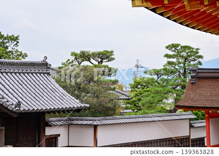 The nature view from Fushimi Inari Taisha(Fushimi Inari Shrine) in Kyoto, Japan. Fushimi Inari Shrine is a popular tourist destination. Stunning nature view of Kyoto. Trees, sky and architecture. The nature view from Fushimi Inari Taisha(Fushimi Inari Shrine) in Kyoto, Japan. Fushimi Inari Shrine is a popular tourist destination. Stunning nature view of Kyoto. Trees, sky and architecture. 139363828