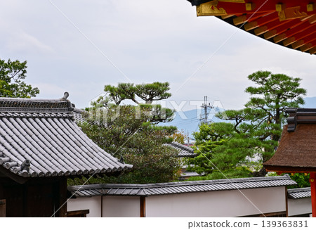 The nature view from Fushimi Inari Taisha(Fushimi Inari Shrine) in Kyoto, Japan. Fushimi Inari Shrine is a popular tourist destination. Stunning nature view of Kyoto. Trees, sky and architecture. The nature view from Fushimi Inari Taisha(Fushimi Inari Shrine) in Kyoto, Japan. Fushimi Inari Shrine is a popular tourist destination. Stunning nature view of Kyoto. Trees, sky and architecture. 139363831