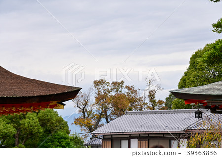 The nature view from Fushimi Inari Taisha(Fushimi Inari Shrine) in Kyoto, Japan. Fushimi Inari Shrine is a popular tourist destination. Stunning nature view of Kyoto. Trees, sky and architecture. The nature view from Fushimi Inari Taisha(Fushimi Inari Shrine) in Kyoto, Japan. Fushimi Inari Shrine is a popular tourist destination. Stunning nature view of Kyoto. Trees, sky and architecture. 139363836