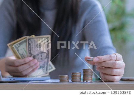 woman working from home concept saving money for finance accounting. woman working from home concept saving money for finance accounting. 139363878