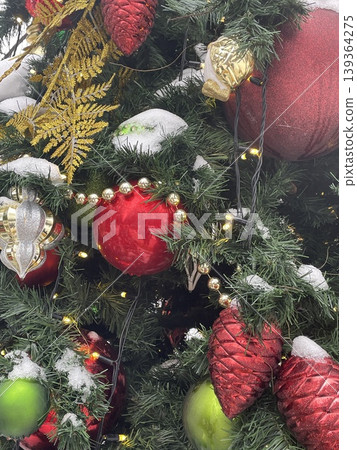 Christmas tree decorated with red and green ornaments and lights, festive holiday background 139364275