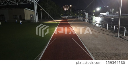 An image of a straight red road at night, and a path leading towards the light. An image of a straight red road at night, and a path leading towards the light. 139364380