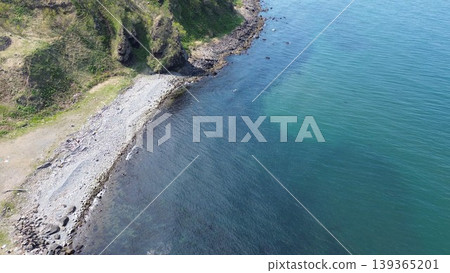 Aerial view of the natural scenery of the Bishabetsu River estuary in Hamamasu and the Sea of Japan, Ishikari City, Hokkaido. Aerial view of the natural scenery of the Bishabetsu River estuary in Hamamasu and the Sea of Japan, Ishikari City, Hokkaido. 139365201