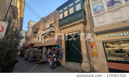 Townscape of narrow shopping street with gift shops in a tourist area 139365326