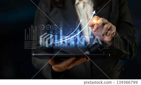Business professional analyzing financial data on tablet with graph indicators and upward trend lines to depict growth and success in modern workplace Scalp Business professional analyzing financial data on tablet with graph indicators and upward trend lines to depict growth and success in modern workplace Scalp 139366799