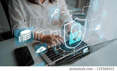 Secure Digital Workspace Concept with User Typing on Laptop Surrounded by Data Protection Icons and Graphics in a Modern Office Environment Sigmoid. Secure Digital Workspace Concept with User Typing on Laptop Surrounded by Data Protection Icons and Graphics in a Modern Office Environment Sigmoid. 139366925
