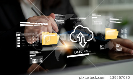 Business professional using digital interface to upload and download data with cloud technology and world map background in modern office setting Ledger Business professional using digital interface to upload and download data with cloud technology and world map background in modern office setting Ledger 139367080