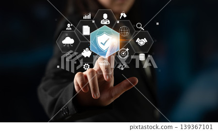 Businessman Interacting with Digital Security Icons Representing Data Protection and Cybersecurity Innovations in a Futuristic Environment Quark Businessman Interacting with Digital Security Icons Representing Data Protection and Cybersecurity Innovations in a Futuristic Environment Quark 139367101