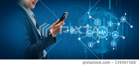 Business professional using smartphone with digital connection icons representing technology, communication, and networking in modern corporate environment. Tessel Business professional using smartphone with digital connection icons representing technology, communication, and networking in modern corporate environment. Tessel 139367168