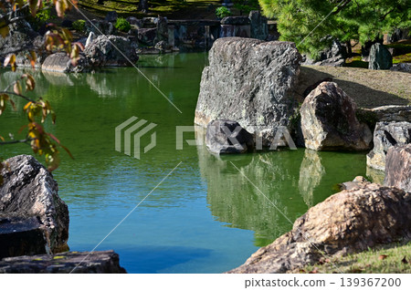 The Japanese gardern view of nijo jo castle, Kyoto, Japan. World Heritage Site, Japanese old traditional architecture in Kyoto, Japan. Background landscape of the beauty of Nijo Castle at sunny day. The Japanese gardern view of nijo jo castle, Kyoto, Japan. World Heritage Site, Japanese old traditional architecture in Kyoto, Japan. Background landscape of the beauty of Nijo Castle at sunny day. 139367200