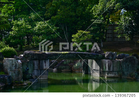 The Japanese gardern view of nijo jo castle, Kyoto, Japan. World Heritage Site, Japanese old traditional architecture in Kyoto, Japan. Background landscape of the beauty of Nijo Castle at sunny day. 139367205