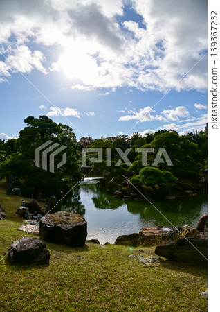 The Japanese gardern view of nijo jo castle, Kyoto, Japan. World Heritage Site, Japanese old traditional architecture in Kyoto, Japan. Background landscape of the beauty of Nijo Castle at sunny day. The Japanese gardern view of nijo jo castle, Kyoto, Japan. World Heritage Site, Japanese old traditional architecture in Kyoto, Japan. Background landscape of the beauty of Nijo Castle at sunny day. 139367232