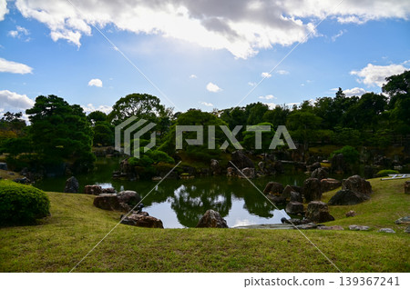 The Japanese gardern view of nijo jo castle, Kyoto, Japan. World Heritage Site, Japanese old traditional architecture in Kyoto, Japan. Background landscape of the beauty of Nijo Castle at sunny day. The Japanese gardern view of nijo jo castle, Kyoto, Japan. World Heritage Site, Japanese old traditional architecture in Kyoto, Japan. Background landscape of the beauty of Nijo Castle at sunny day. 139367241