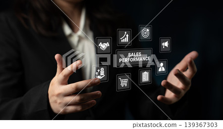 Business Professional Presenting Digital Icons Representing Sales Performance and Growth Metrics with a Focus on Analytics and Strategy Ledger Business Professional Presenting Digital Icons Representing Sales Performance and Growth Metrics with a Focus on Analytics and Strategy Ledger 139367303