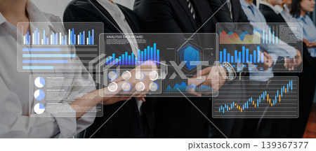 Business Team Collaboration for Data Analysis and Visualization with Graphs and Charts on Digital Screens in Modern Office Environment Gantry 139367377