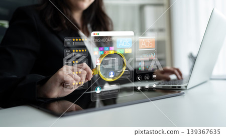 A business professional engages with a digital analytics dashboard on a laptop, visualizing performance metrics and statistical data in a modern workspace setting. Sigmoid A business professional engages with a digital analytics dashboard on a laptop, visualizing performance metrics and statistical data in a modern workspace setting. Sigmoid 139367635