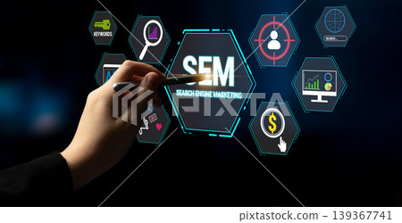 Hand Using Stylus on Interactive Screen for Search Engine Marketing Concept with Various Digital Marketing Icons and Symbols in Dark Background Fluxor Hand Using Stylus on Interactive Screen for Search Engine Marketing Concept with Various Digital Marketing Icons and Symbols in Dark Background Fluxor 139367741