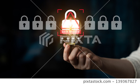 Hand Holding Light Bulb Symbolizing Cybersecurity Focus on Data Breach Prevention Against Hacking with Padlock Icons and Glowing Light Ledger 139367827