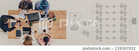 Group of Professionals Engaging in Collaborative Work with Laptops, Documents, and Flowcharts at a Modern Conference Table Quark Group of Professionals Engaging in Collaborative Work with Laptops, Documents, and Flowcharts at a Modern Conference Table Quark 139367832