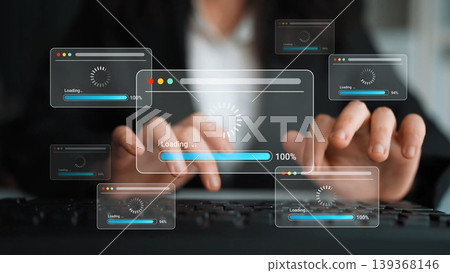 Conceptual image of digital loading screens and progress indicators above hands typing on keyboard, representing online processing and data transfer activities Gluon Conceptual image of digital loading screens and progress indicators above hands typing on keyboard, representing online processing and data transfer activities Gluon 139368146