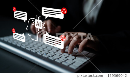 Human hands typing on a keyboard with AI graphics and alert notifications in a dark setting highlighting technology and communication in modern society Gantry Human hands typing on a keyboard with AI graphics and alert notifications in a dark setting highlighting technology and communication in modern society Gantry 139369042