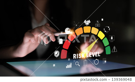 User Analyzing Risk Level on Digital Dashboard with Interactive Graphics and Icons, Conceptual Demonstration of Technology in Business Environment Quark User Analyzing Risk Level on Digital Dashboard with Interactive Graphics and Icons, Conceptual Demonstration of Technology in Business Environment Quark 139369048