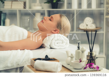 Caucasian woman customer enjoying relaxing anti-stress massage. Quiescent Caucasian woman customer enjoying relaxing anti-stress massage. Quiescent 139369116