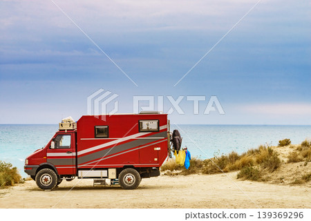 Lorry motorhome with equipment camping on beach 139369296