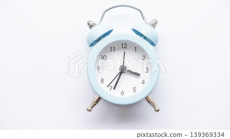 Blue alarm clock on a white background. 139369334