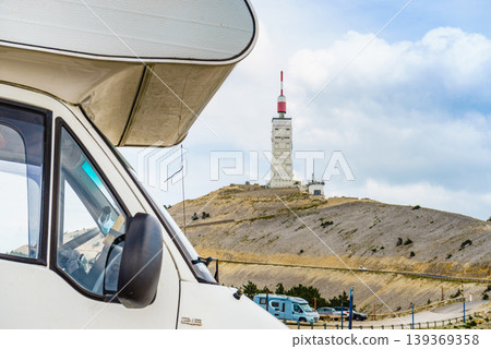 Caravan visiting Mont Ventoux, Provence France. Communications tower and meteorological observatory in the distance 139369358