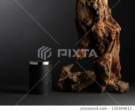 Black empty podium and dried snag on a black background. Black empty podium and dried snag on a black background. 139369612